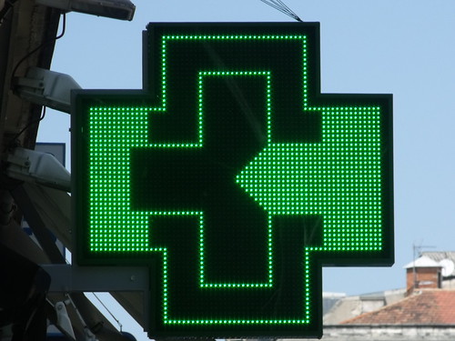 Rue de la Republique, Avignon - Green cross on pharmacy