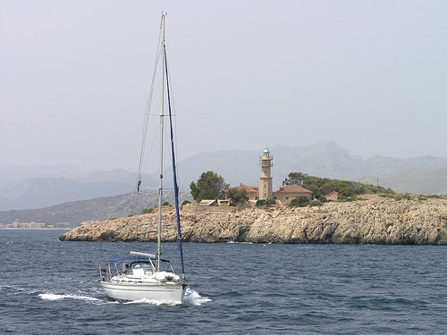 Mallorca- sailing boat passing the lighthouse